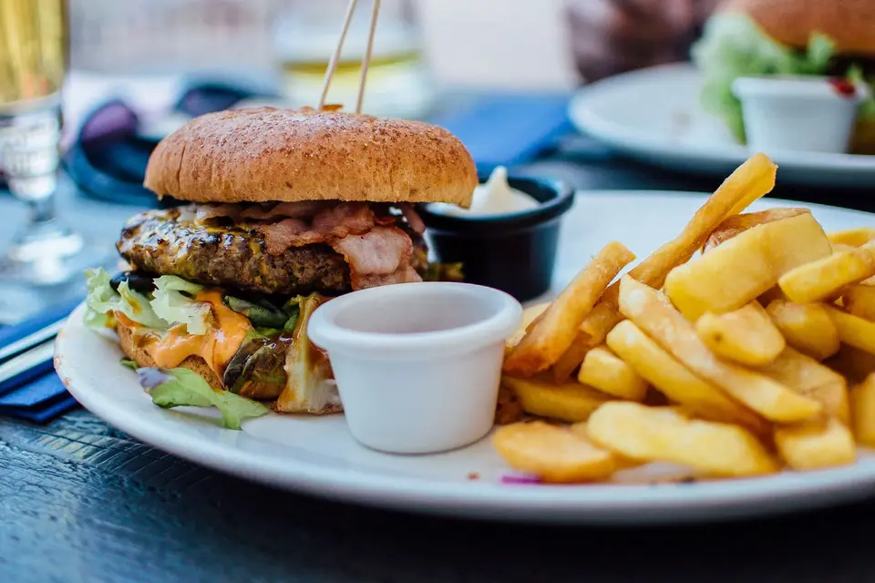Burger and fries on a white plate