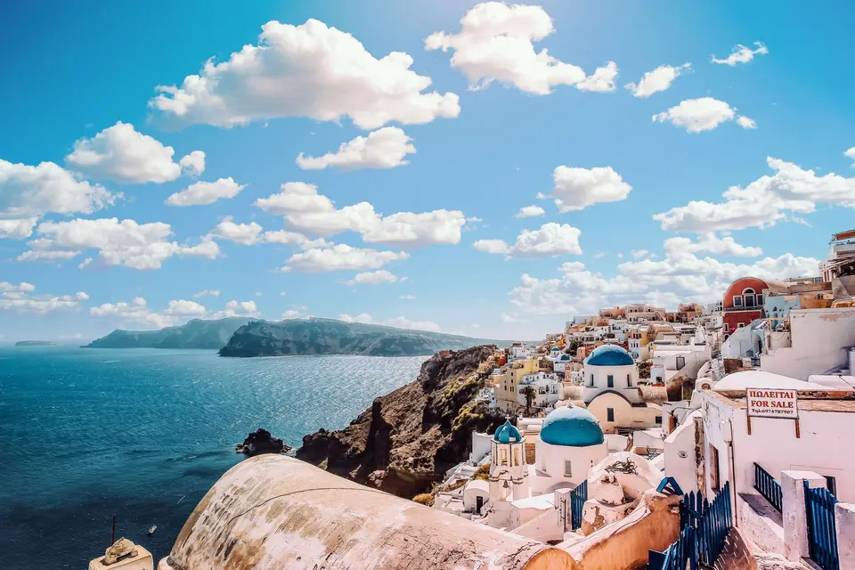 White buildings and blue domes above the sea in Santorini